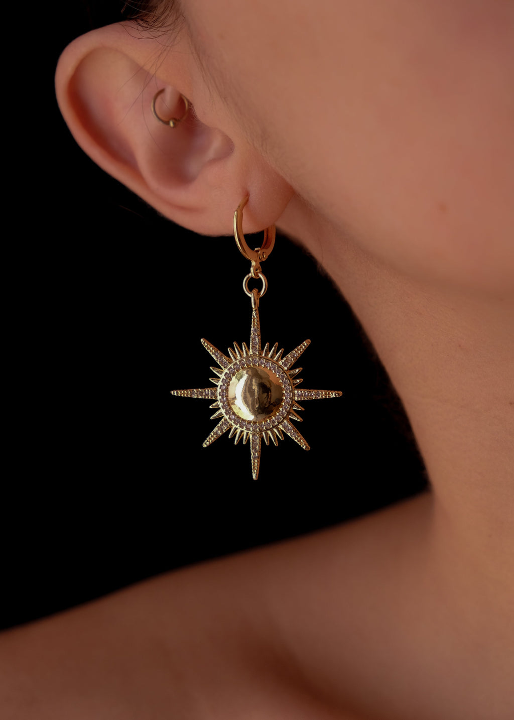Gold suns earrings